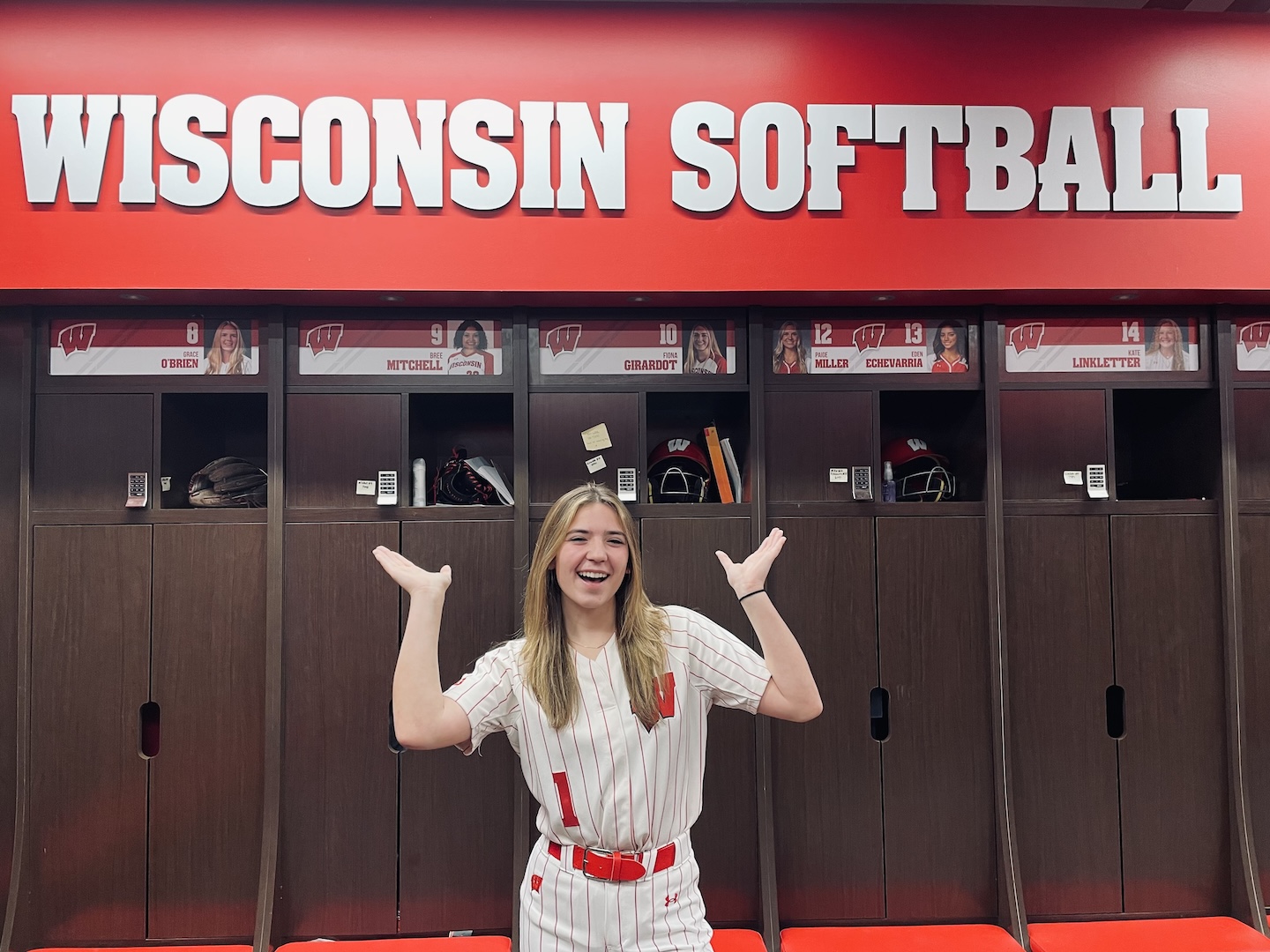 Madison Werner enjoying some time in the Badgers softball locker room